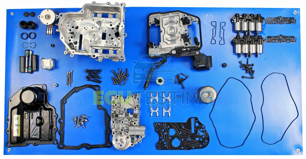 Transmission components arranged in rows on a blue work mat