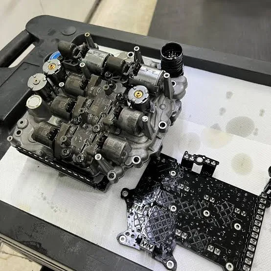 Two valve-body and mechatronic assemblies arranged on a clean work surface